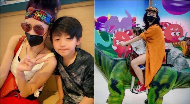 张柏芝晒出陪儿子游乐园玩耍照！张柏芝戴口罩陪儿子玩旋转木马、骑恐龙